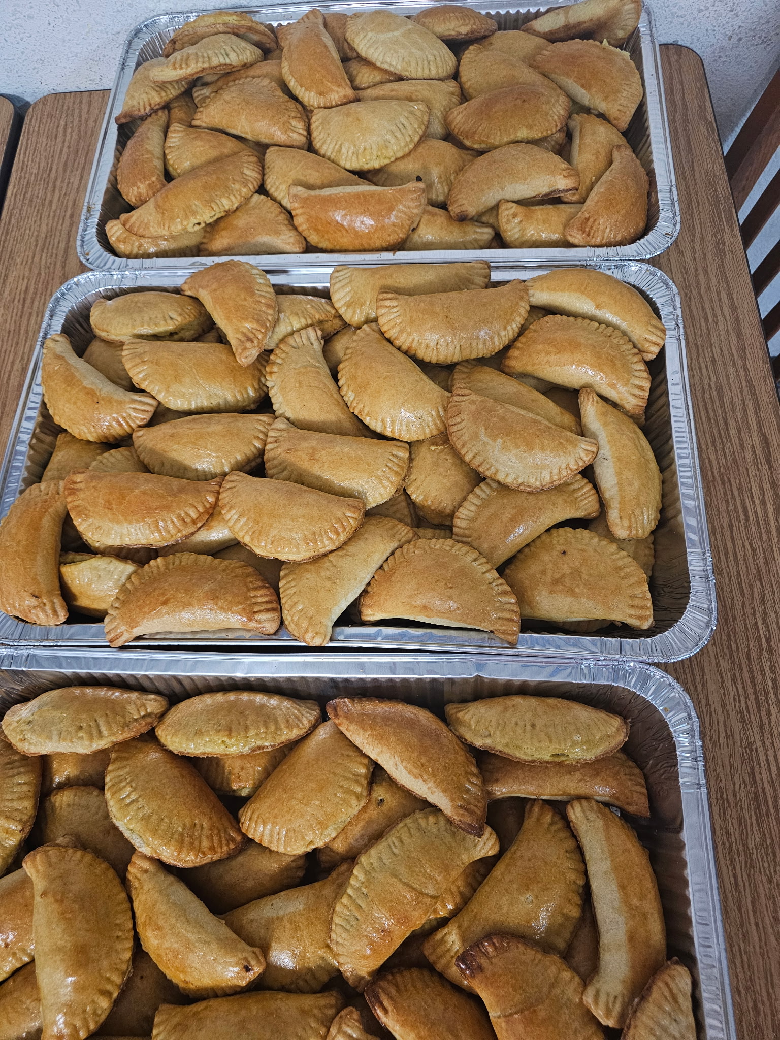 Trays of golden Nigerian meat pies