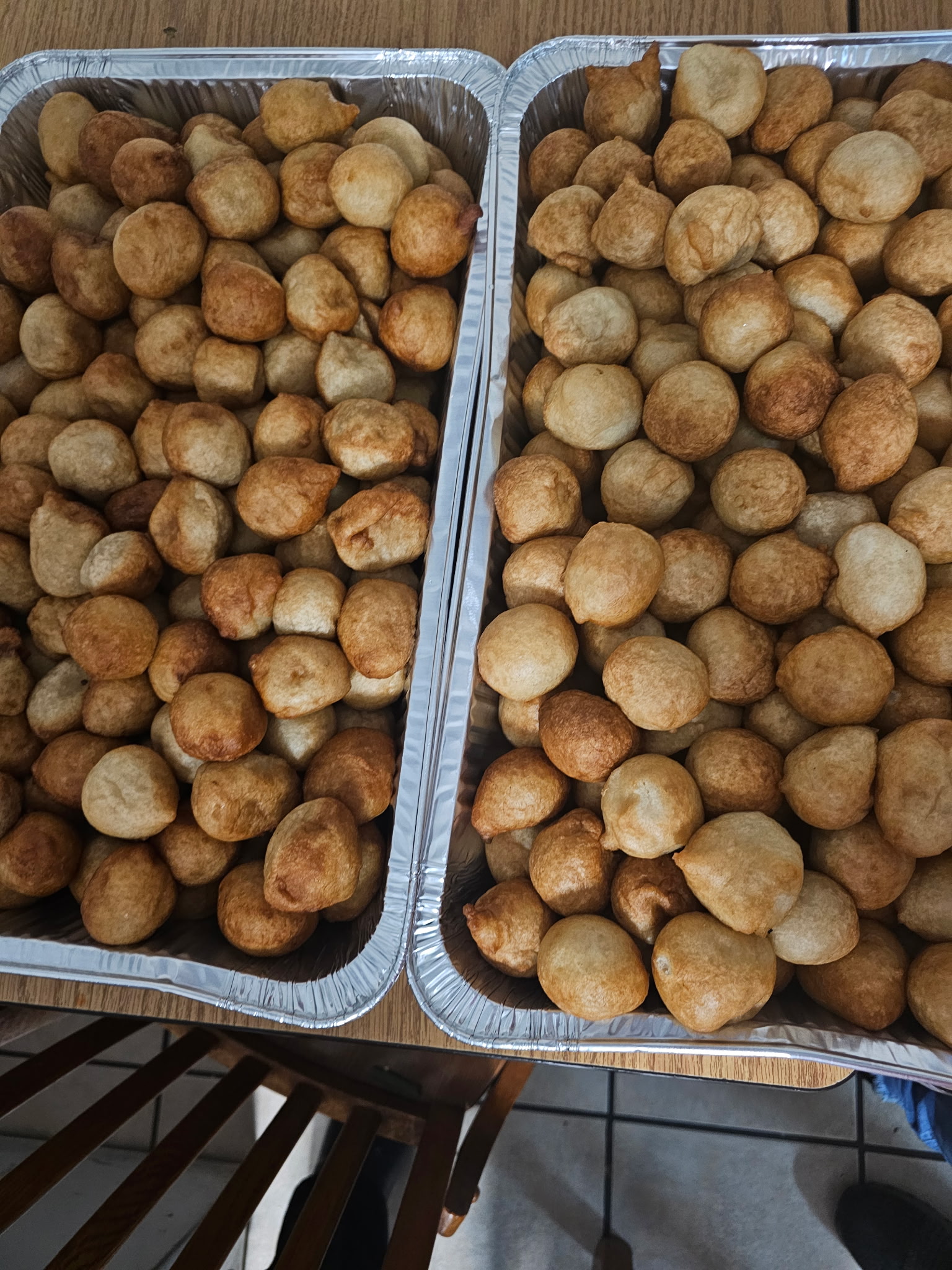 Two large trays of fresh puff puff