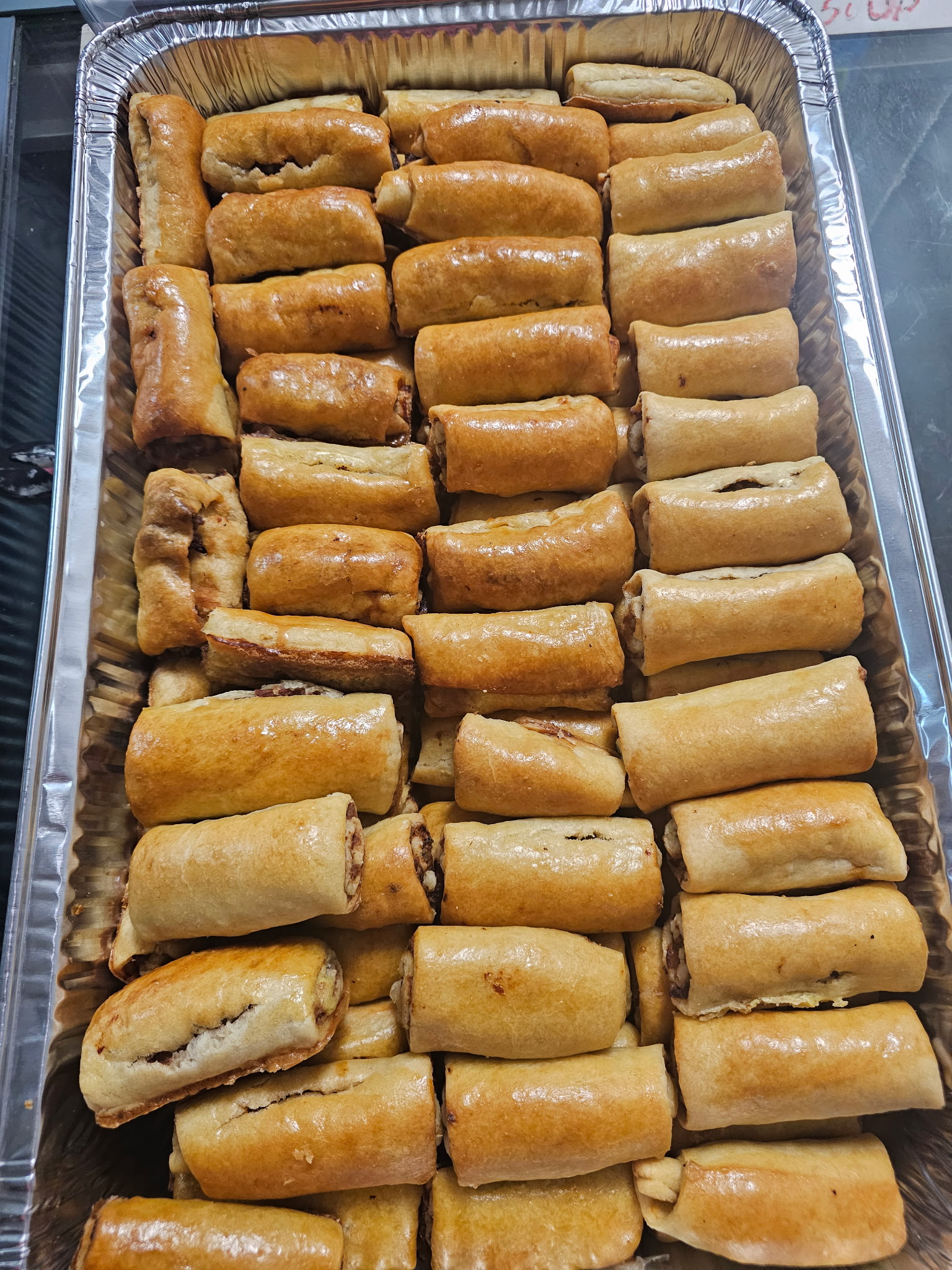 Tray of freshly baked sausage rolls